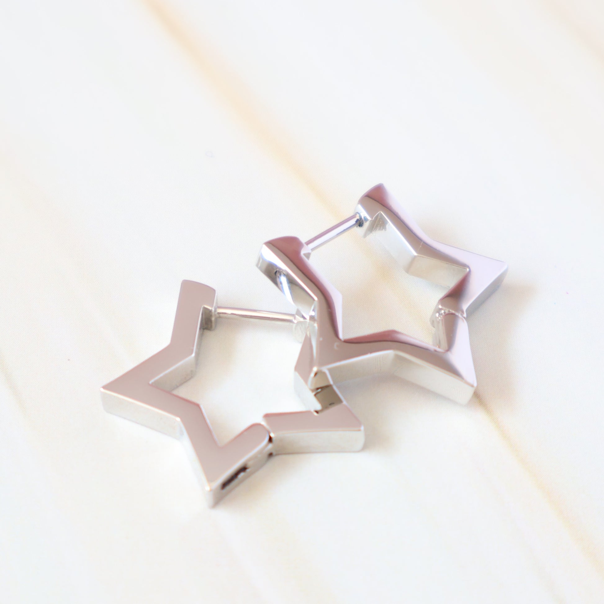 silver issy star earrings