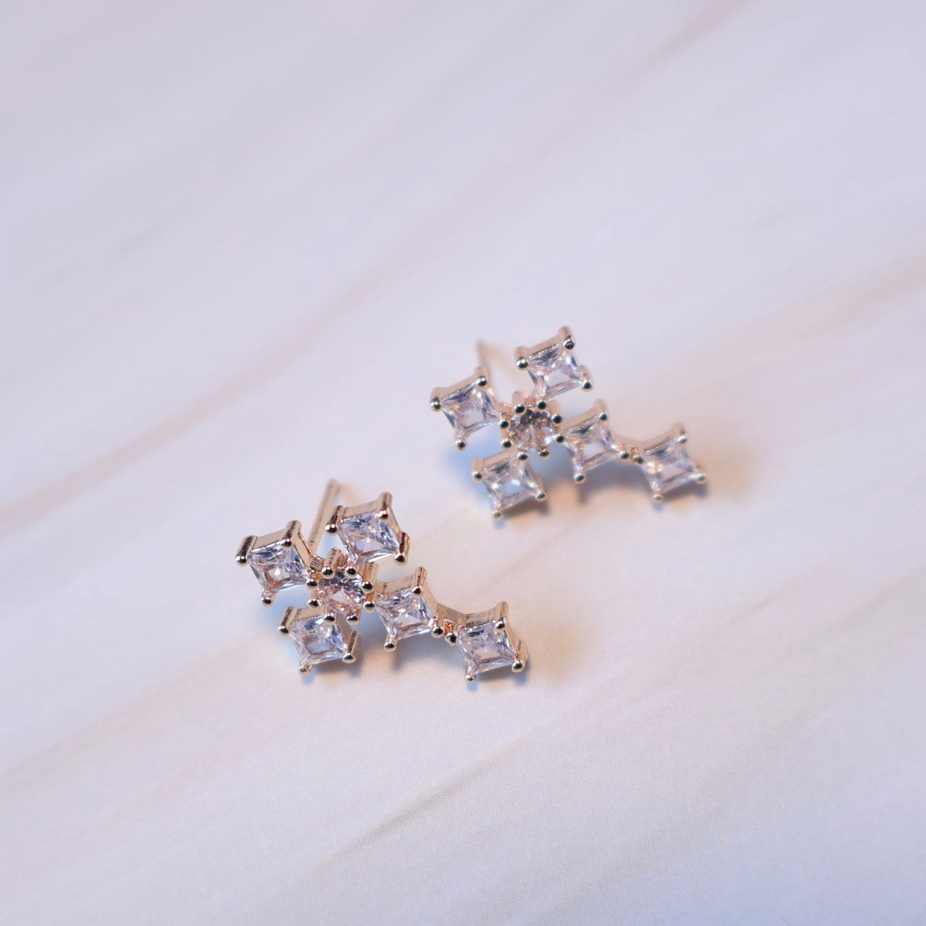 Cubic zirconia paved cross stud earrings 