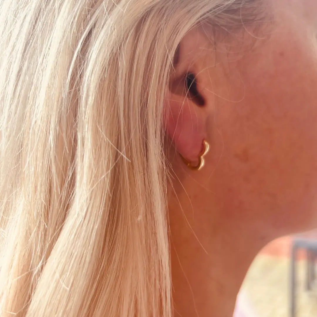 Gold heart shaped hoops