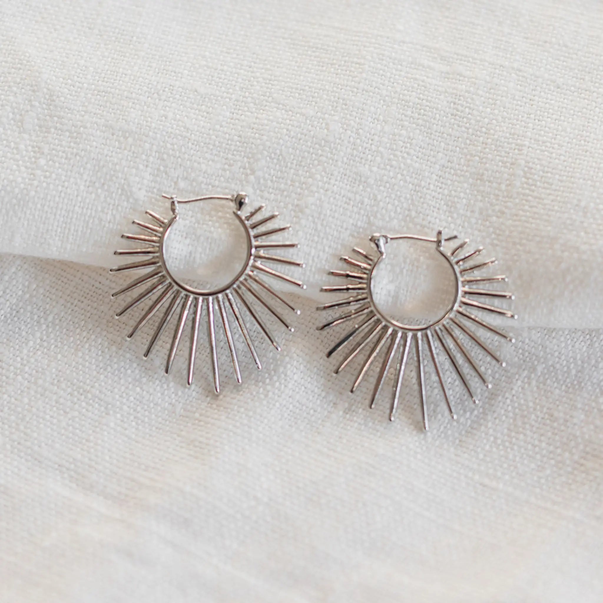 white gold spikey sun hoops