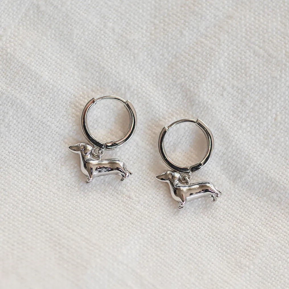 white gold Huggies with sausage dog charm