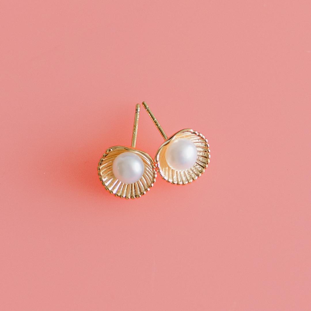 Gold shell earrings with mother of pearl centre