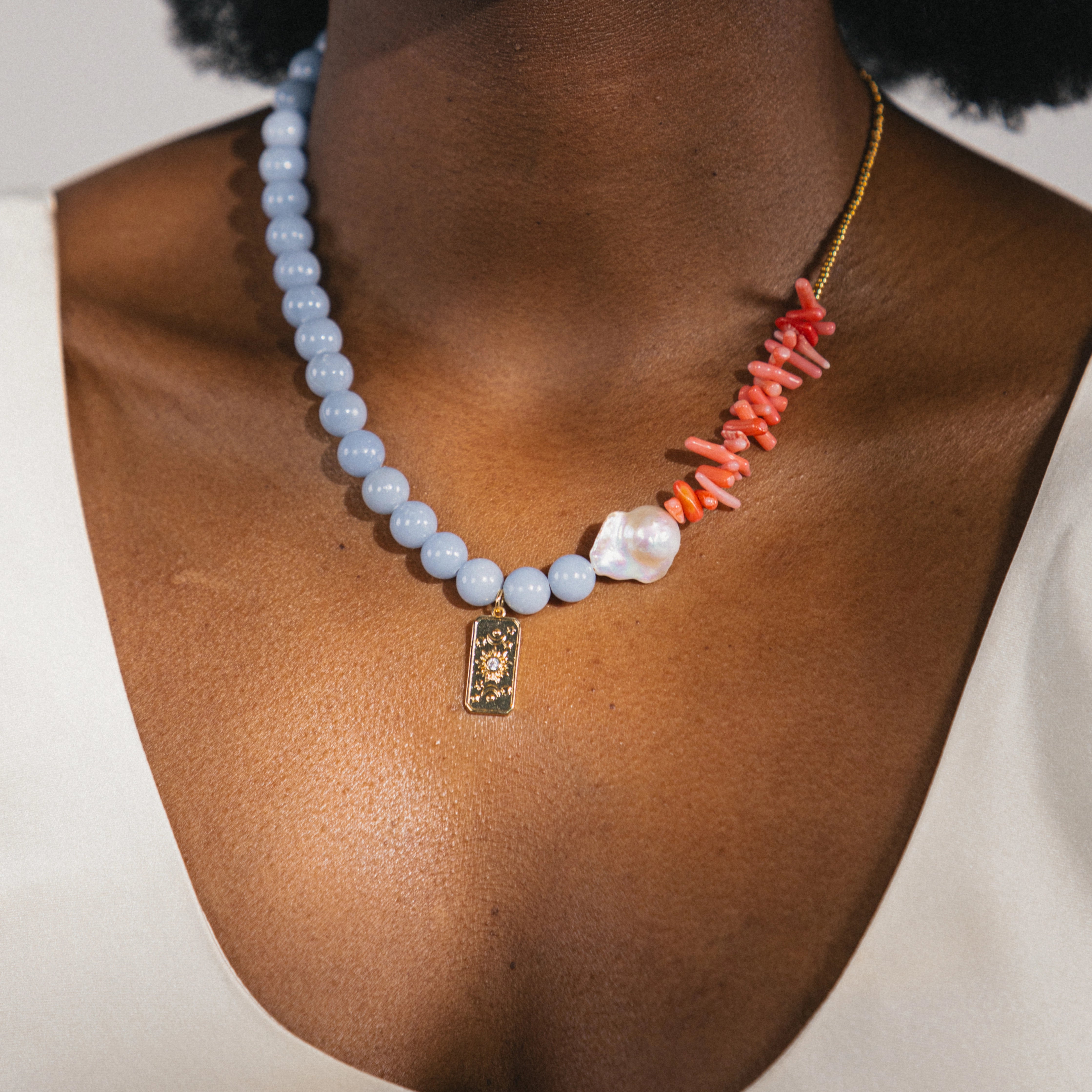 coral and Angelite gemstone necklace with tarot card pendant and pearl detail 