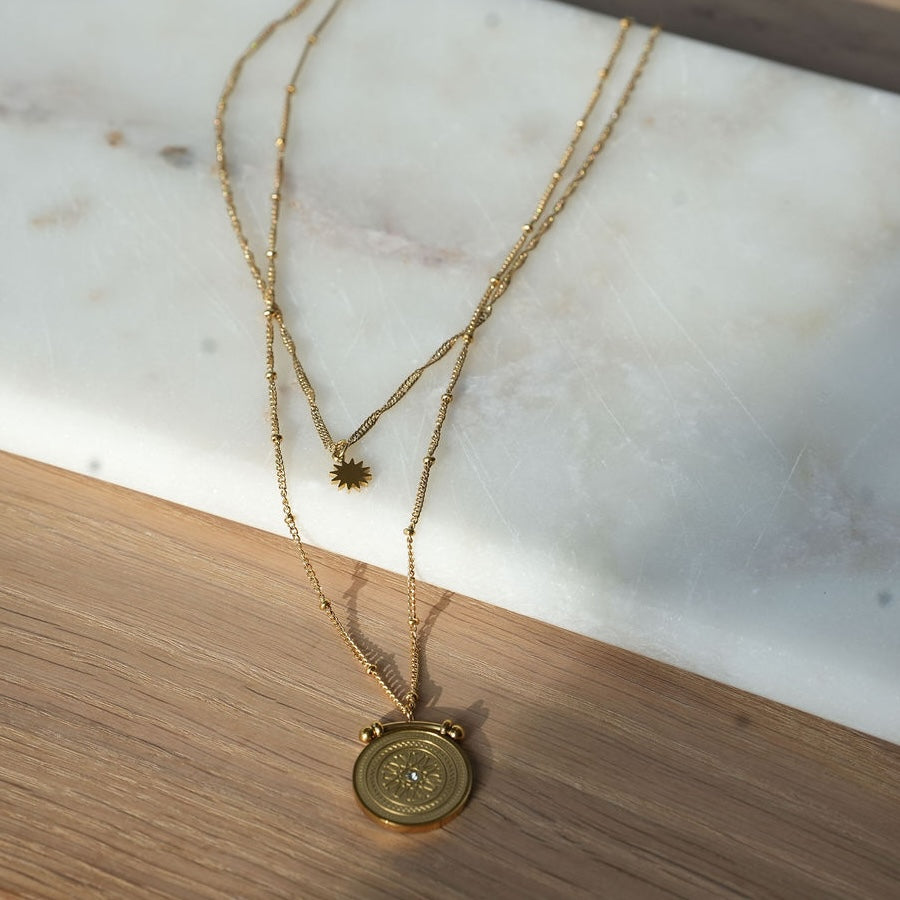 double layer gold necklace with star and medallion