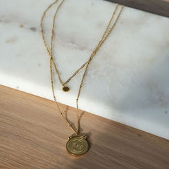 double layer gold necklace with star and medallion