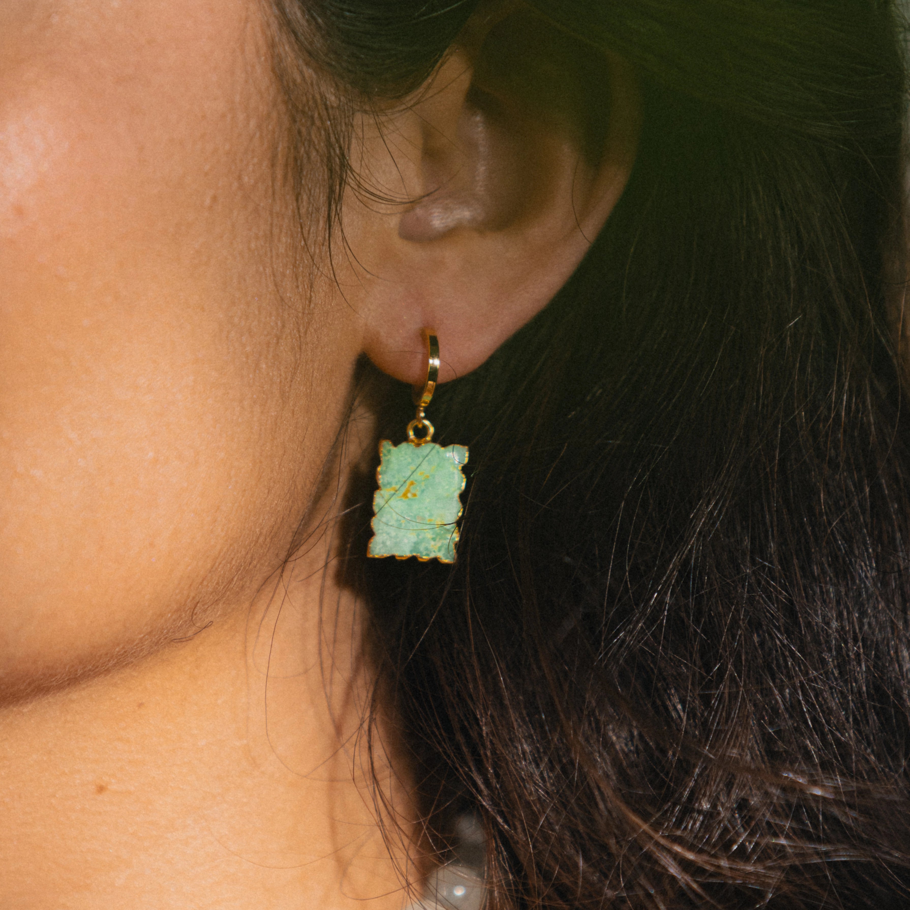 gold huggies with green gemstone charm 