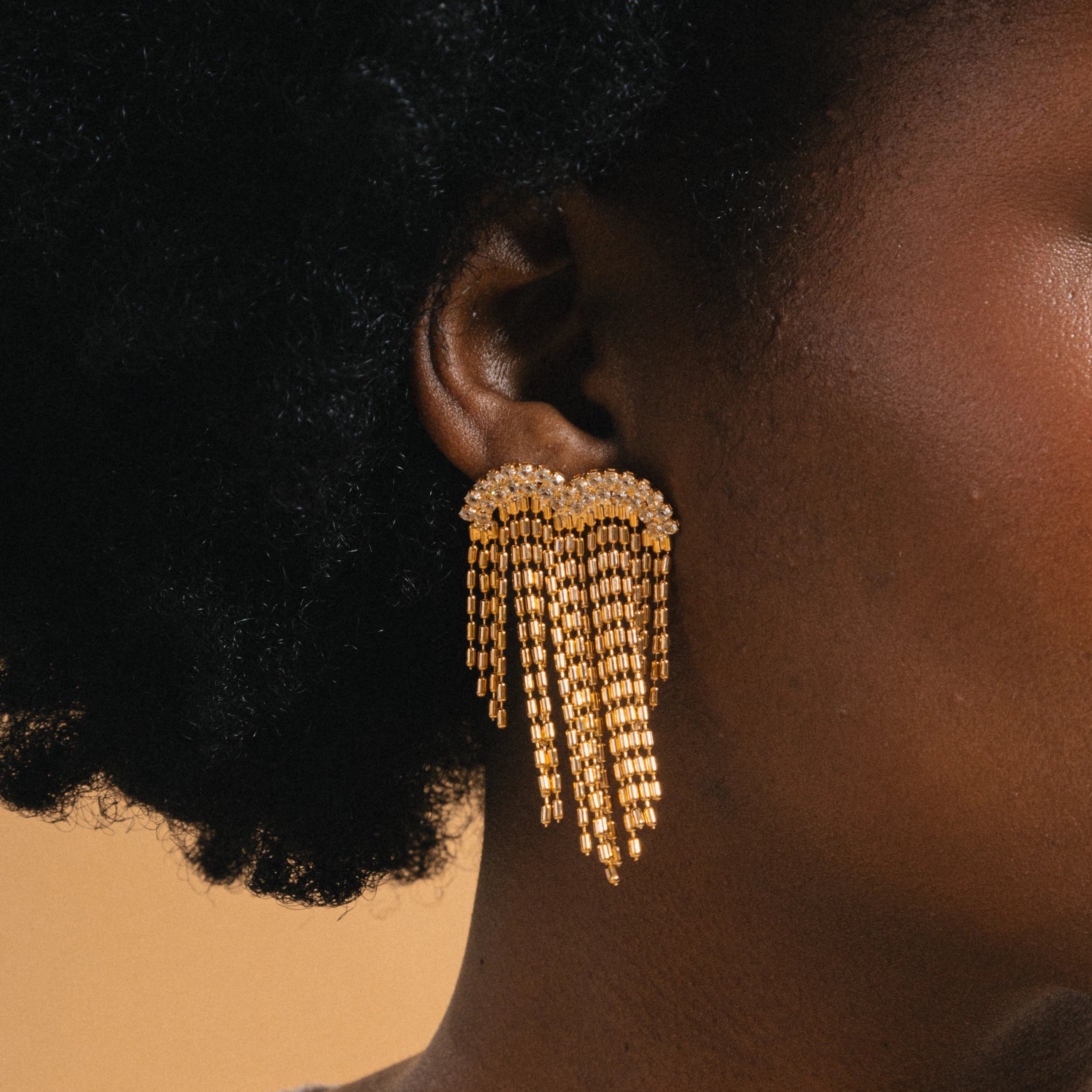 gold chain tassel earrings with cubic zirconia detail 