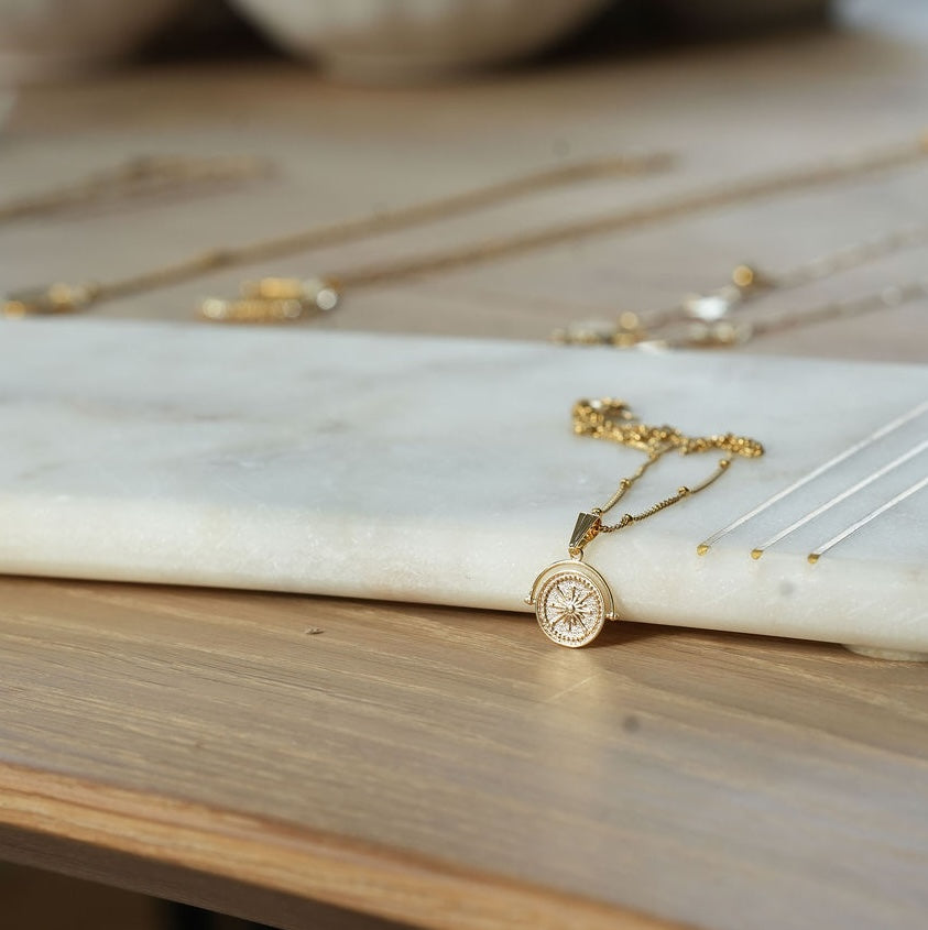 Gold compass necklace 