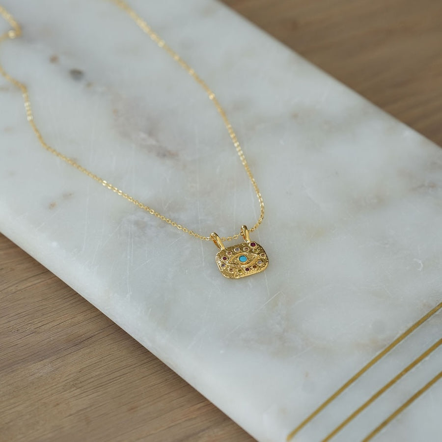gold evil eye pendant necklace 