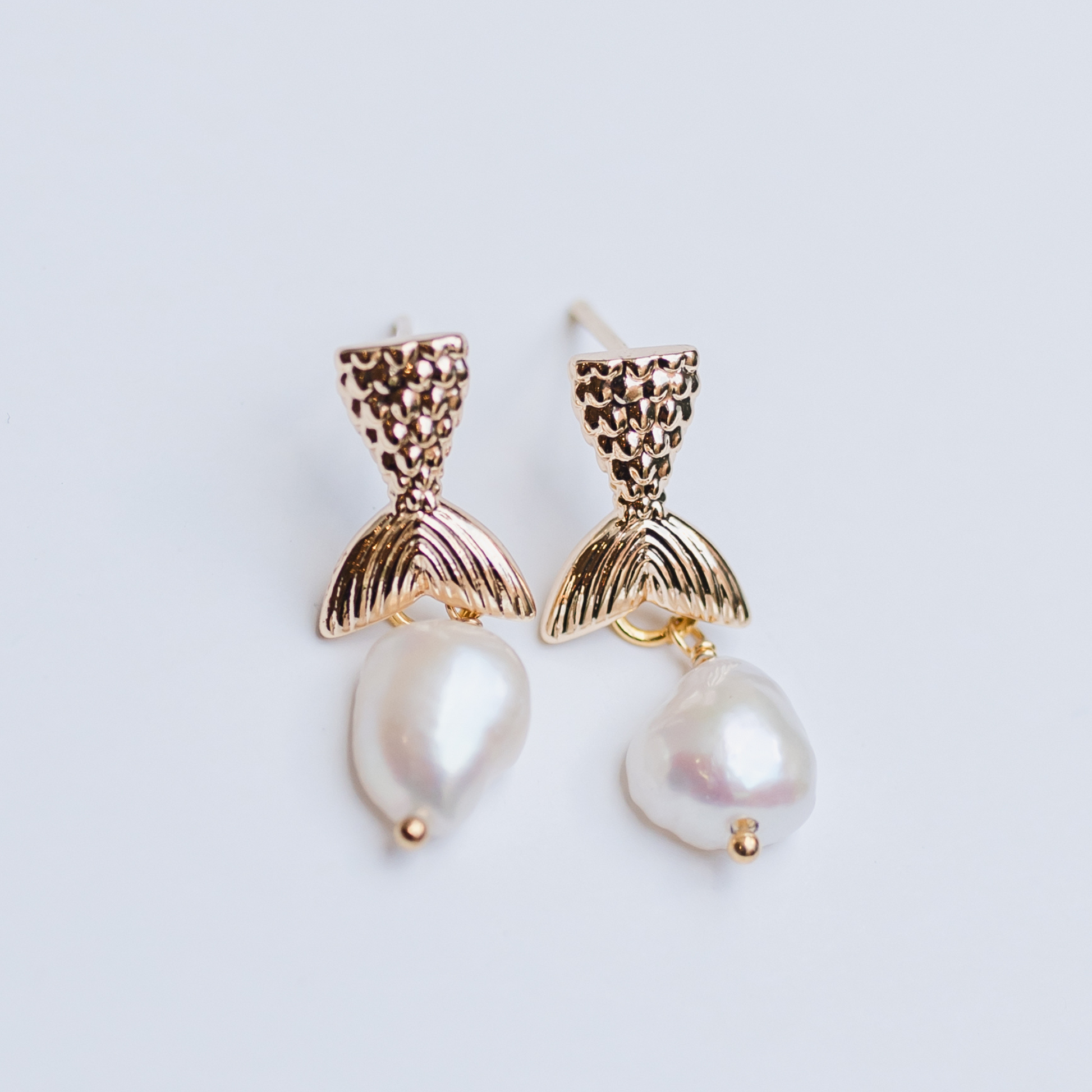 Gold mermaid tail with pearl drop earring