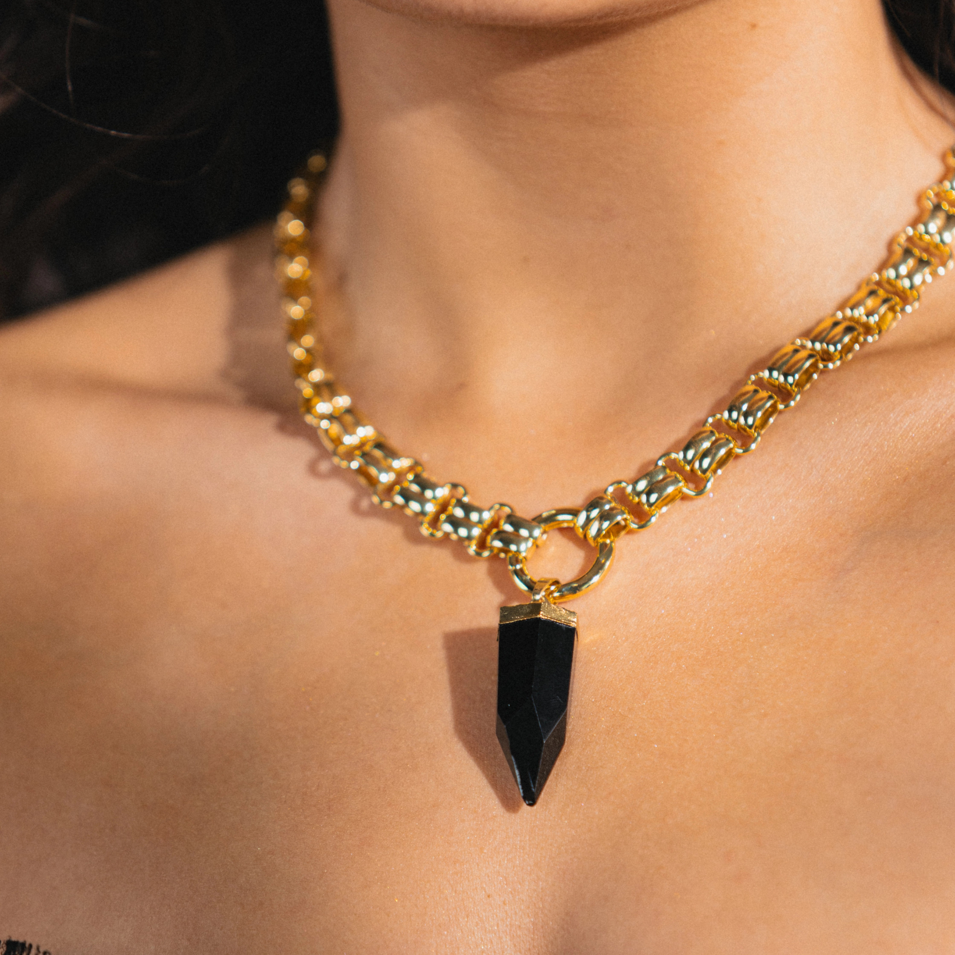 gold necklace with chunky obsidian charm 