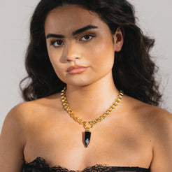 gold necklace with obsidian gemstone