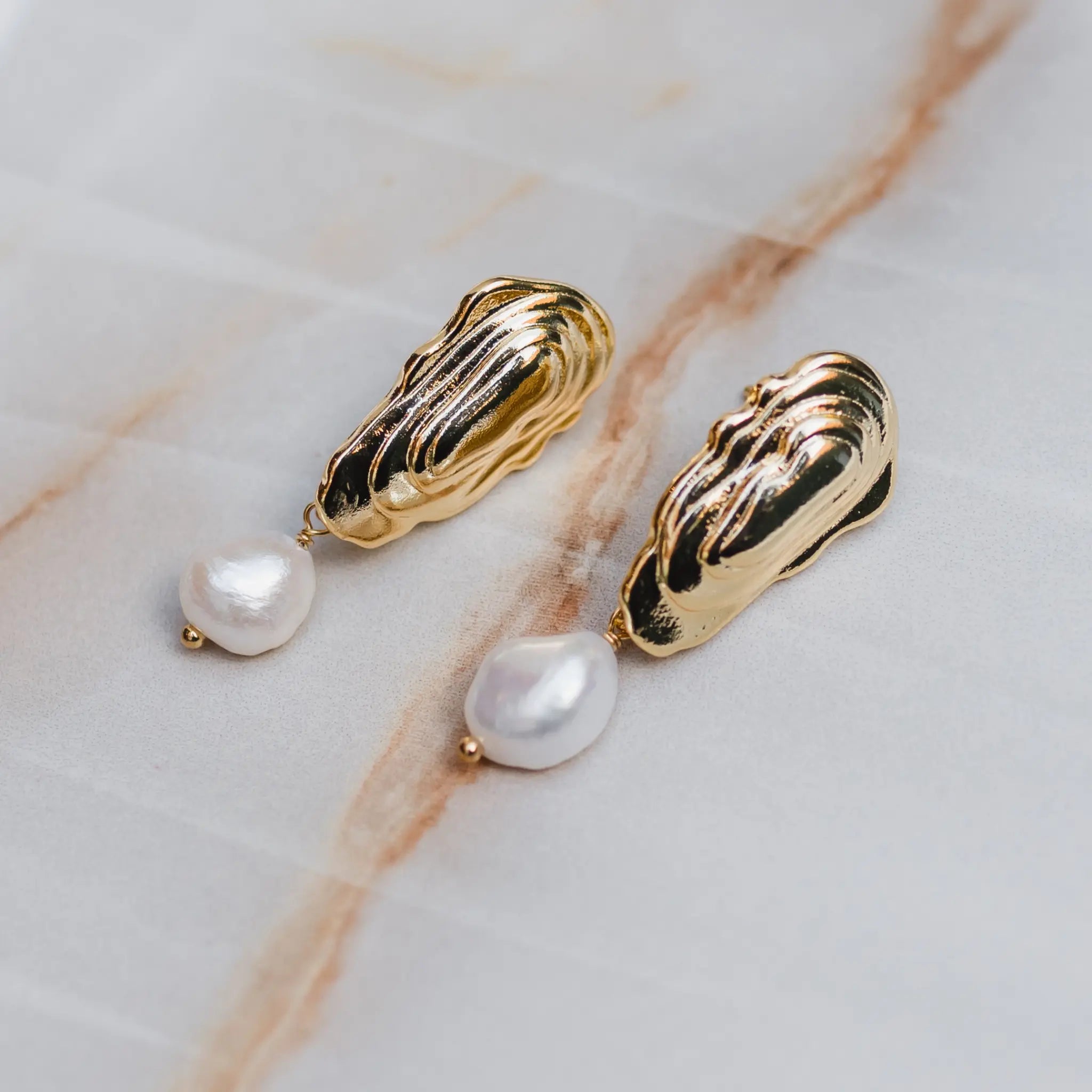 gold oyster earrings with pearl drop 