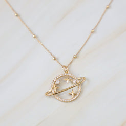 gold planet pendant with cz detail 