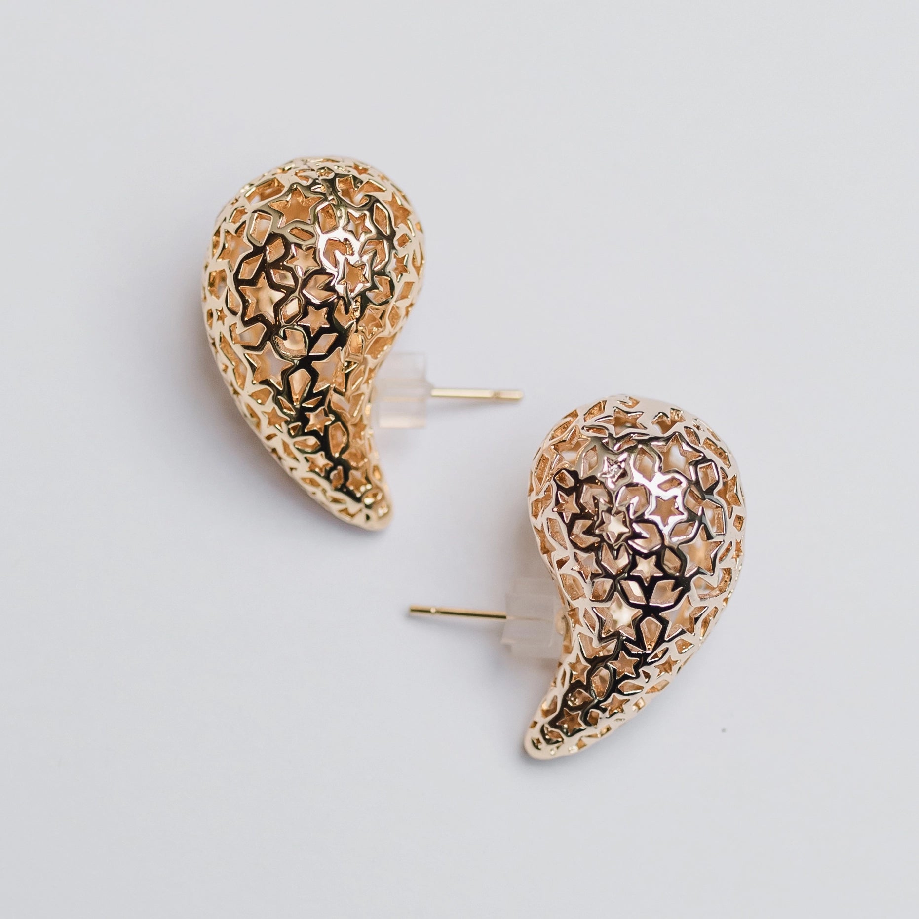 gold teardrop earrings with star detail 