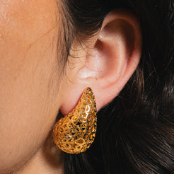 gold teardrop earring with star detail