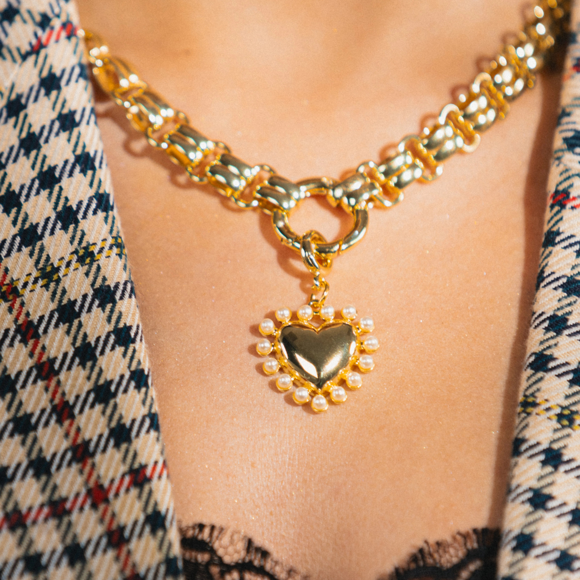 heart charm on gold necklace 