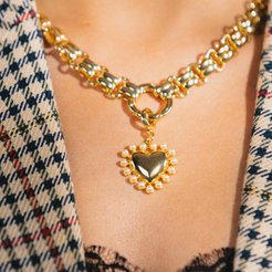 heart charm on gold necklace 