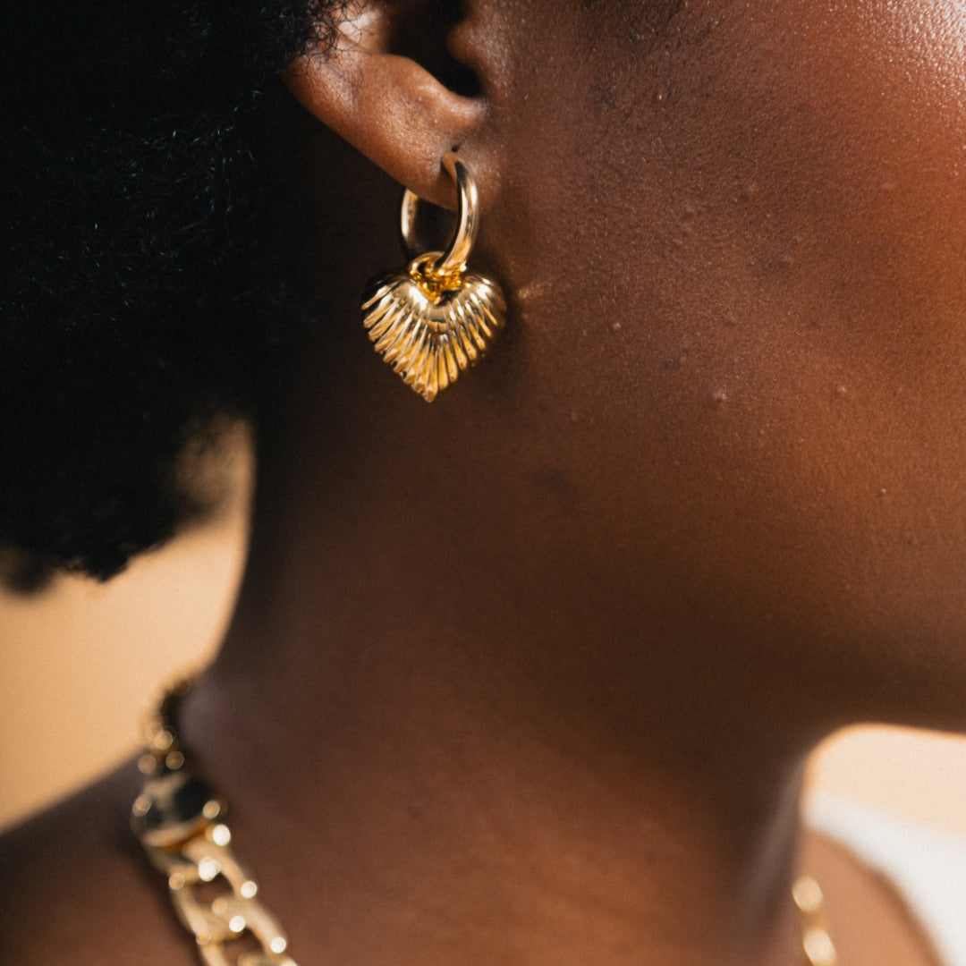 gold hoop with textured heart charm earring