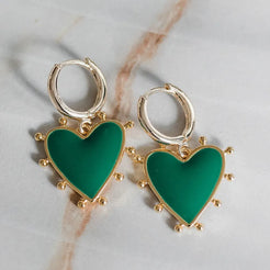 green heart charm on gold huggie 