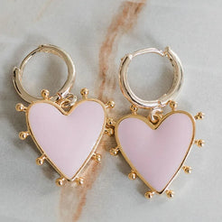 pink heart charm on gold huggie 