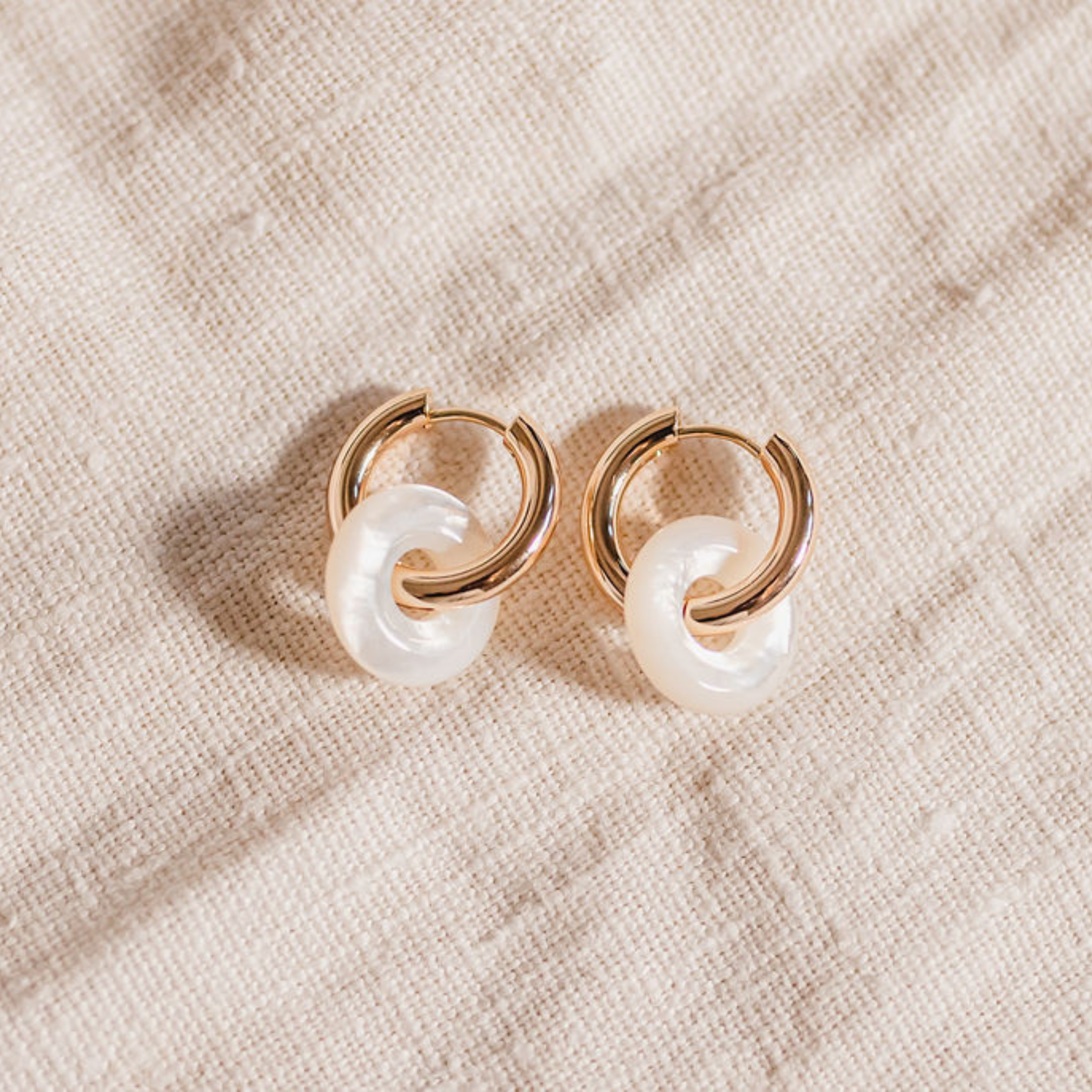 Small gold hoop with mother of pearl ring drop