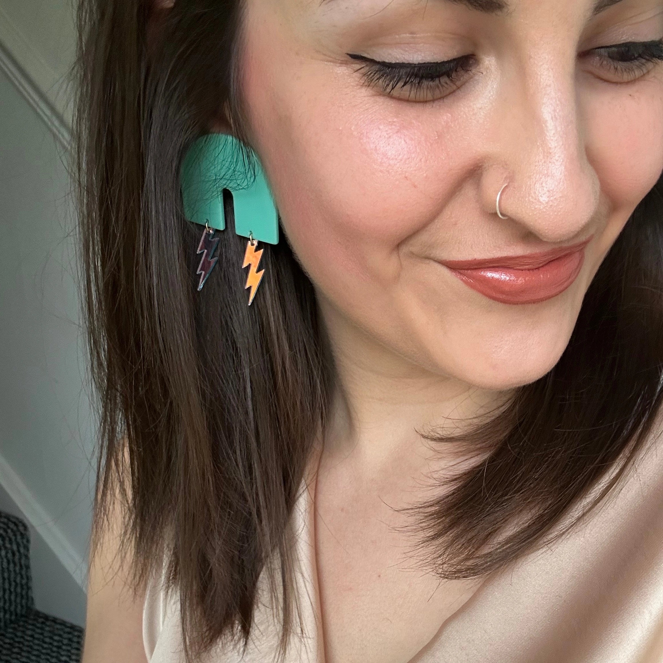 large blue arch statement earrings