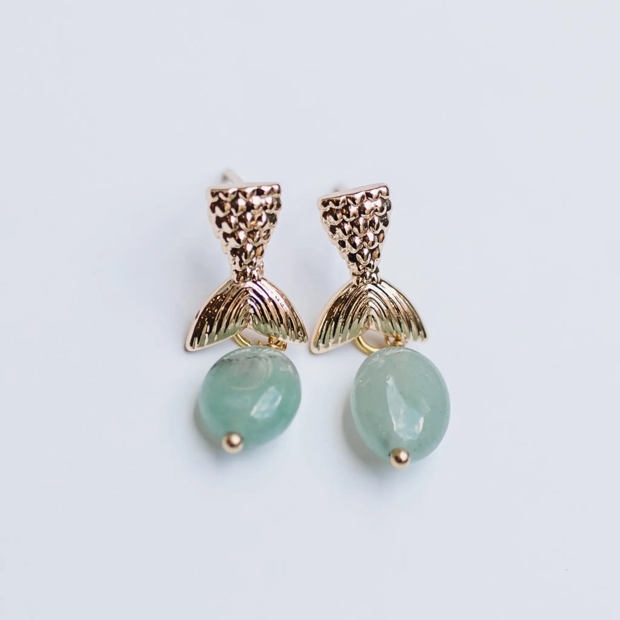 gold mermaid tail earrings with gemstone drop 